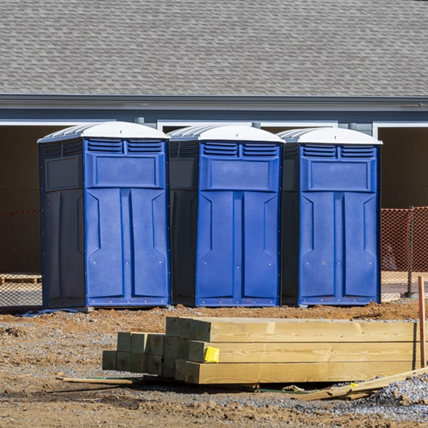 what is the cost difference between standard and deluxe portable toilet rentals in Parkman